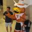 Parents pose with inflatable Hook 'Em
