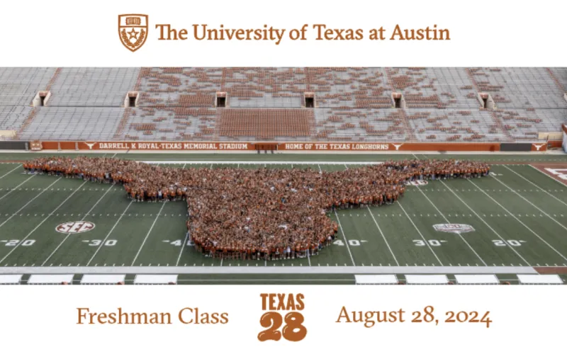 students posing together on the DKR field in the shape of a longhorn