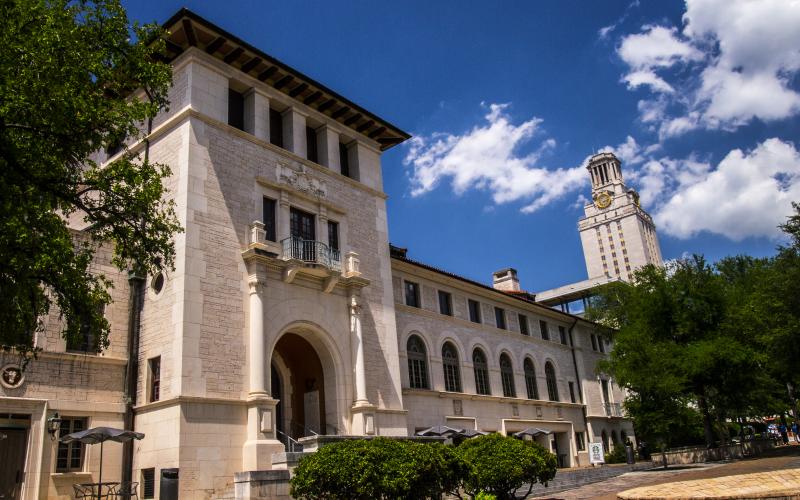 Picture of the texas union on a sunny day with the tower in the background